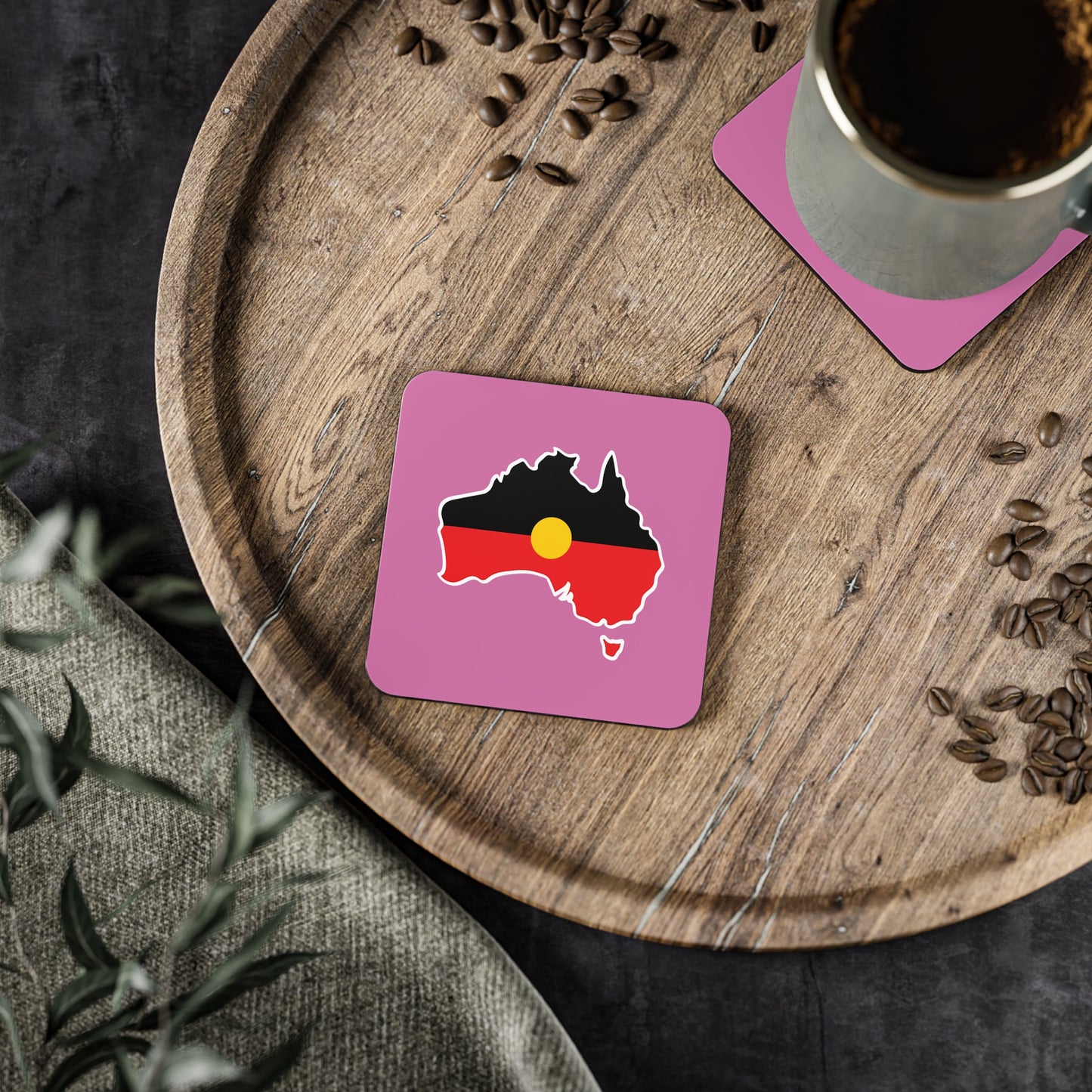 Pink square Aboriginal coaster, Australia design, in dining setting