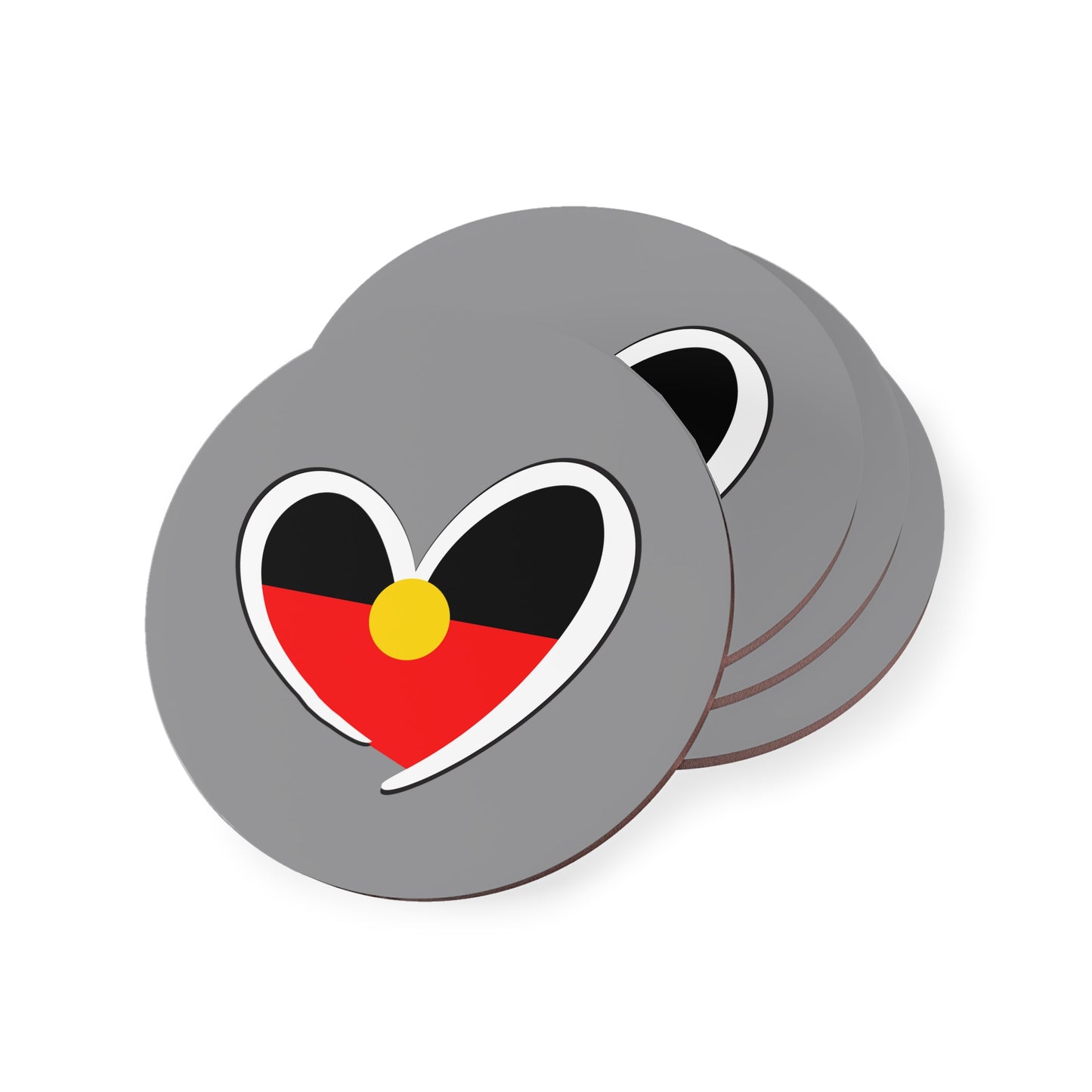 Stacked round grey coasters featuring Aboriginal heart symbol, ideal for everyday use.