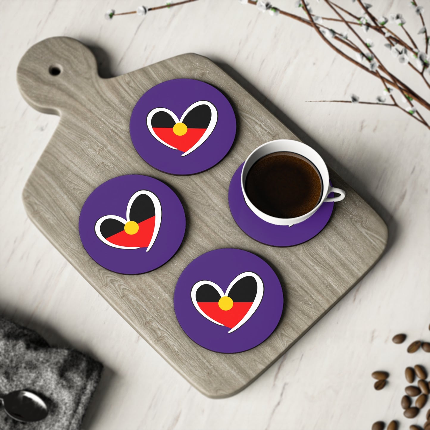 Purple round coaster set of four with Aboriginal heart, perfect for coffee table settings.